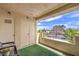 Relaxing balcony with artificial turf, storage, seating, and a scenic view of the neighborhood at 4809 S Torrey Pines Dr # 201, Las Vegas, NV 89103