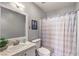Bright bathroom with a vanity, toilet, and shower at 4809 S Torrey Pines Dr # 201, Las Vegas, NV 89103