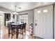 Dining area with a table, hardwood floors, and bright natural light by the front door at 4809 S Torrey Pines Dr # 201, Las Vegas, NV 89103