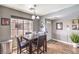 Cozy dining area featuring a dark wood table, modern decor, and a view towards the entryway at 4809 S Torrey Pines Dr # 201, Las Vegas, NV 89103