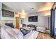Comfortable living room with a stone fireplace, plush seating, and modern decor at 4809 S Torrey Pines Dr # 201, Las Vegas, NV 89103