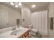 Full bathroom with a single sink vanity and shower over tub at 5005 Justice Creek Ave, Las Vegas, NV 89131