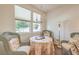 Bright breakfast nook featuring a round table, stylish chandelier, and window views, perfect for casual meals at 5005 Justice Creek Ave, Las Vegas, NV 89131