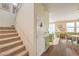 Hallway featuring a staircase and access to the kitchen, offering a glimpse of the home's layout at 5005 Justice Creek Ave, Las Vegas, NV 89131