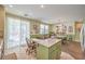 Spacious kitchen with tile floors, an island, and an open layout to the breakfast area at 5005 Justice Creek Ave, Las Vegas, NV 89131