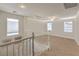 Carpeted loft space with bright light from multiple windows at 5005 Justice Creek Ave, Las Vegas, NV 89131