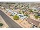 An aerial view of a residential neighborhood featuring well-maintained homes with varied landscaping and street layouts at 525 Engel Ave, Henderson, NV 89011