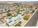 An aerial view of the neighborhood featuring homes with varied roof styles, landscaping, and solar panel installations at 525 Engel Ave, Henderson, NV 89011
