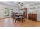 Elegant dining room with classic furnishings, wood floors, and decorative shelving at 525 Engel Ave, Henderson, NV 89011