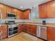 Beautiful kitchen with stainless steel appliances, granite countertops, and wood cabinets at 525 Engel Ave, Henderson, NV 89011