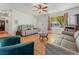 Bright living room with wood floors and cozy seating area, bathed in natural light at 525 Engel Ave, Henderson, NV 89011
