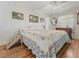 Cozy main bedroom with hardwood floors, ceiling fan, and plenty of natural light at 525 Engel Ave, Henderson, NV 89011