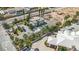 Aerial view of lush desert neighborhood and palm tree landscaping at 5890 W Patrick Ln, Las Vegas, NV 89118