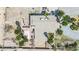 Aerial view featuring a home's backyard patio with pergola, pool, desert landscaping, and outdoor furniture at 5890 W Patrick Ln, Las Vegas, NV 89118