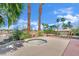 Backyard showcasing a jacuzzi and lush tropical landscaping at 5890 W Patrick Ln, Las Vegas, NV 89118