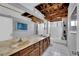 Bathroom featuring a double sink vanity, tile flooring and shower-tub combo at 5890 W Patrick Ln, Las Vegas, NV 89118