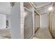 Bathroom showcasing glass-enclosed shower and mirrored closet doors with metallic trim at 5890 W Patrick Ln, Las Vegas, NV 89118