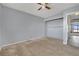 Bedroom featuring a ceiling fan, closet space, and walls that require repair at 5890 W Patrick Ln, Las Vegas, NV 89118