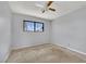 Bedroom featuring a ceiling fan, window, and walls that require repair at 5890 W Patrick Ln, Las Vegas, NV 89118
