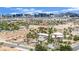 Expansive single-story homes nestled among lush palm trees and landscaping with a beautiful Las Vegas cityscape view at 5890 W Patrick Ln, Las Vegas, NV 89118