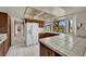 Kitchen featuring tile countertops, a bay window, and white appliances at 5890 W Patrick Ln, Las Vegas, NV 89118