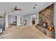 Unfinished living room featuring stone fireplace and open floorplan at 5890 W Patrick Ln, Las Vegas, NV 89118