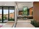 Modern bathroom featuring dual sinks, a marble countertop, and a large window with a scenic view at 6 Vista Crescent Ct, Henderson, NV 89012