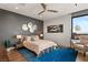 Cozy bedroom featuring a stylish rug, a modern ceiling fan, and a reading chair at 6 Vista Crescent Ct, Henderson, NV 89012