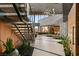 Grand entryway with a modern floating staircase, sleek design elements, and abundant natural light at 6 Vista Crescent Ct, Henderson, NV 89012