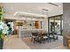 Open kitchen and dining area featuring modern cabinets, marble countertops, and stainless steel appliances at 6 Vista Crescent Ct, Henderson, NV 89012