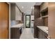 Modern laundry room with sleek cabinetry, countertops, and appliances, with a view of the outdoors at 6 Vista Crescent Ct, Henderson, NV 89012