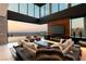 Living room with city views and a linear fireplace at 6 Vista Crescent Ct, Henderson, NV 89012