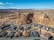 Aerial view of single Gathering homes in a developing community with desert landscaping at 647 Quarry Pass, Mesquite, NV 89034