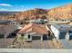 Aerial view of a residential neighborhood with tile roofs and mountain backdrop at 647 Quarry Pass, Mesquite, NV 89034
