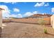 Expansive gravel backyard enclosed by a brick wall with minimal desert landscaping at 647 Quarry Pass, Mesquite, NV 89034
