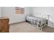 Bright bedroom with natural light, featuring a comfortable bed and dresser for ample storage at 647 Quarry Pass, Mesquite, NV 89034