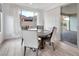 Bright dining area features wood floors, backyard access, and beautiful views of the surrounding area at 647 Quarry Pass, Mesquite, NV 89034