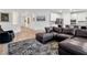 Open-concept living area with sleek wood floors, leather seating, and seamless flow to the kitchen at 647 Quarry Pass, Mesquite, NV 89034