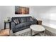 Inviting living room with gray sofa, decorative pillows, patterned rug, and stylish decor at 647 Quarry Pass, Mesquite, NV 89034