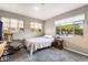 This bedroom features carpet flooring and multiple windows for natural light at 650 Arizona St, Boulder City, NV 89005