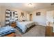 Comfortable bedroom with carpet flooring, a window with curtains, and neutral decor at 650 Arizona St, Boulder City, NV 89005