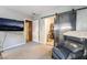 This bedroom offers carpet, a tv, a closet, and an oversized chair at 650 Arizona St, Boulder City, NV 89005