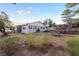 Single-story home showcasing desert landscaping, large windows and proximity to nature at 650 Arizona St, Boulder City, NV 89005
