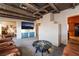 Relaxing living room with wooden ceilings, a modern television, and comfortable seating at 650 Arizona St, Boulder City, NV 89005