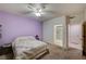 Comfortable bedroom featuring a ceiling fan, carpet, and a bathroom at 6916 Dorita Ave # 101, Las Vegas, NV 89108