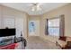 Bedroom with neutral paint, carpet, closet, and window at 6916 Dorita Ave # 101, Las Vegas, NV 89108