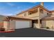 Well-maintained two-story home featuring a garage and a neatly paved driveway for easy parking at 6916 Dorita Ave # 101, Las Vegas, NV 89108