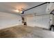 Spacious two car garage with white storage cabinets and an automatic door at 6916 Dorita Ave # 101, Las Vegas, NV 89108