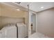 Laundry room with white washer and dryer at 6916 Dorita Ave # 101, Las Vegas, NV 89108