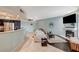 Bright living area with a fireplace, seamlessly connected to a modern kitchen for easy socializing at 6916 Dorita Ave # 101, Las Vegas, NV 89108